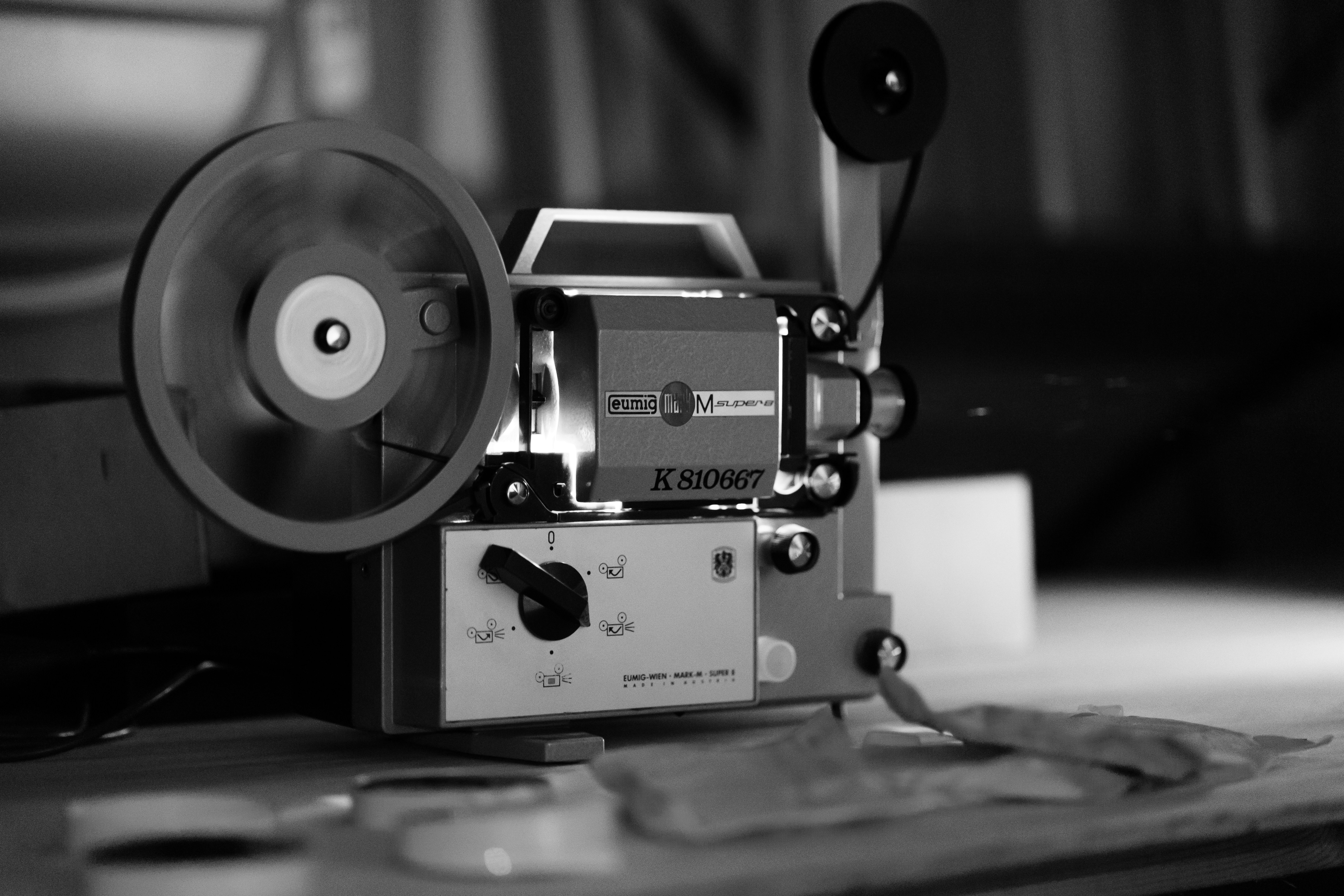 Classic film camera on desk, representing media production and storytelling