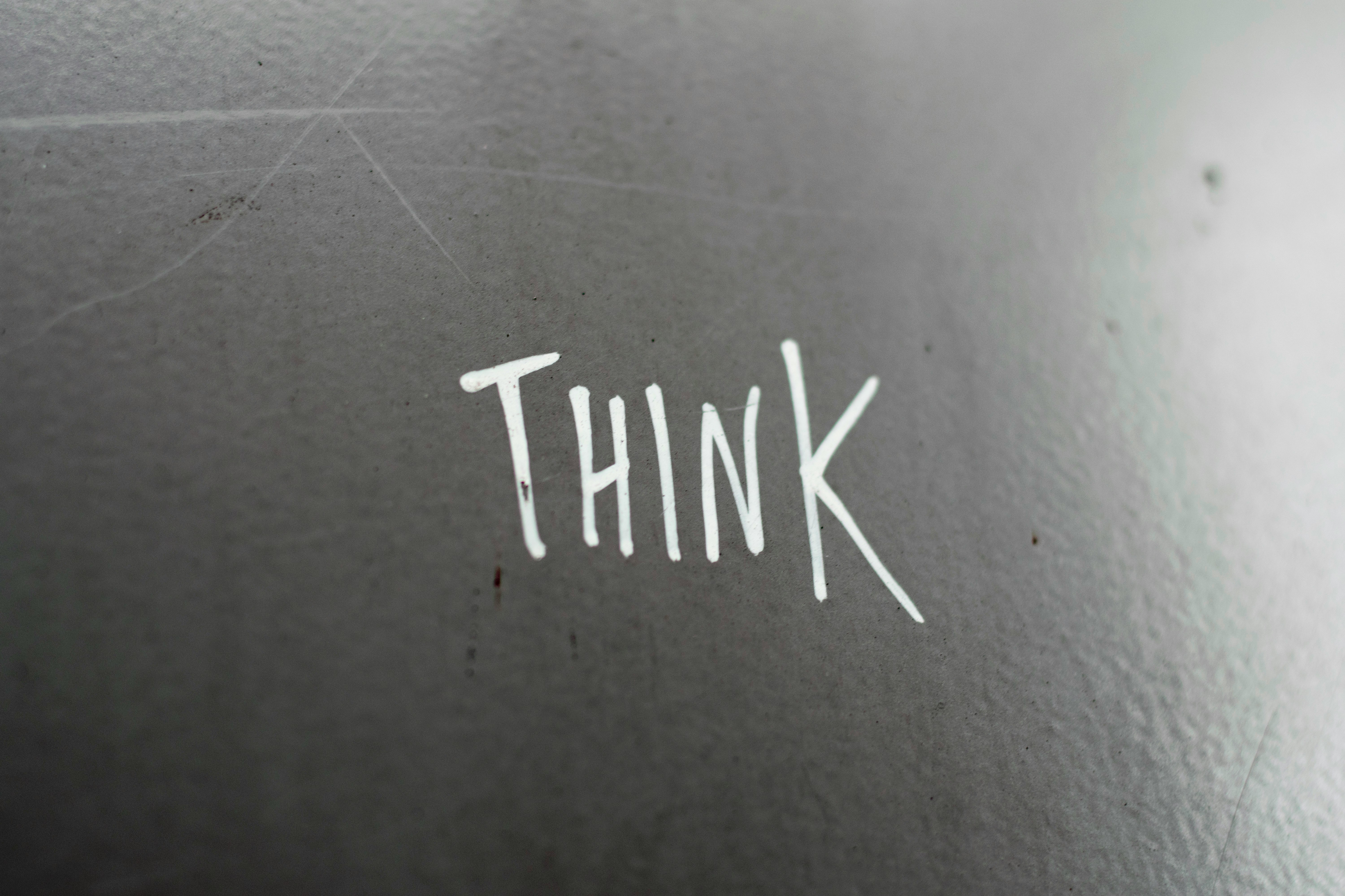 Minimalistic handwritten Think text, ideal for podcast brainstorming inspiration