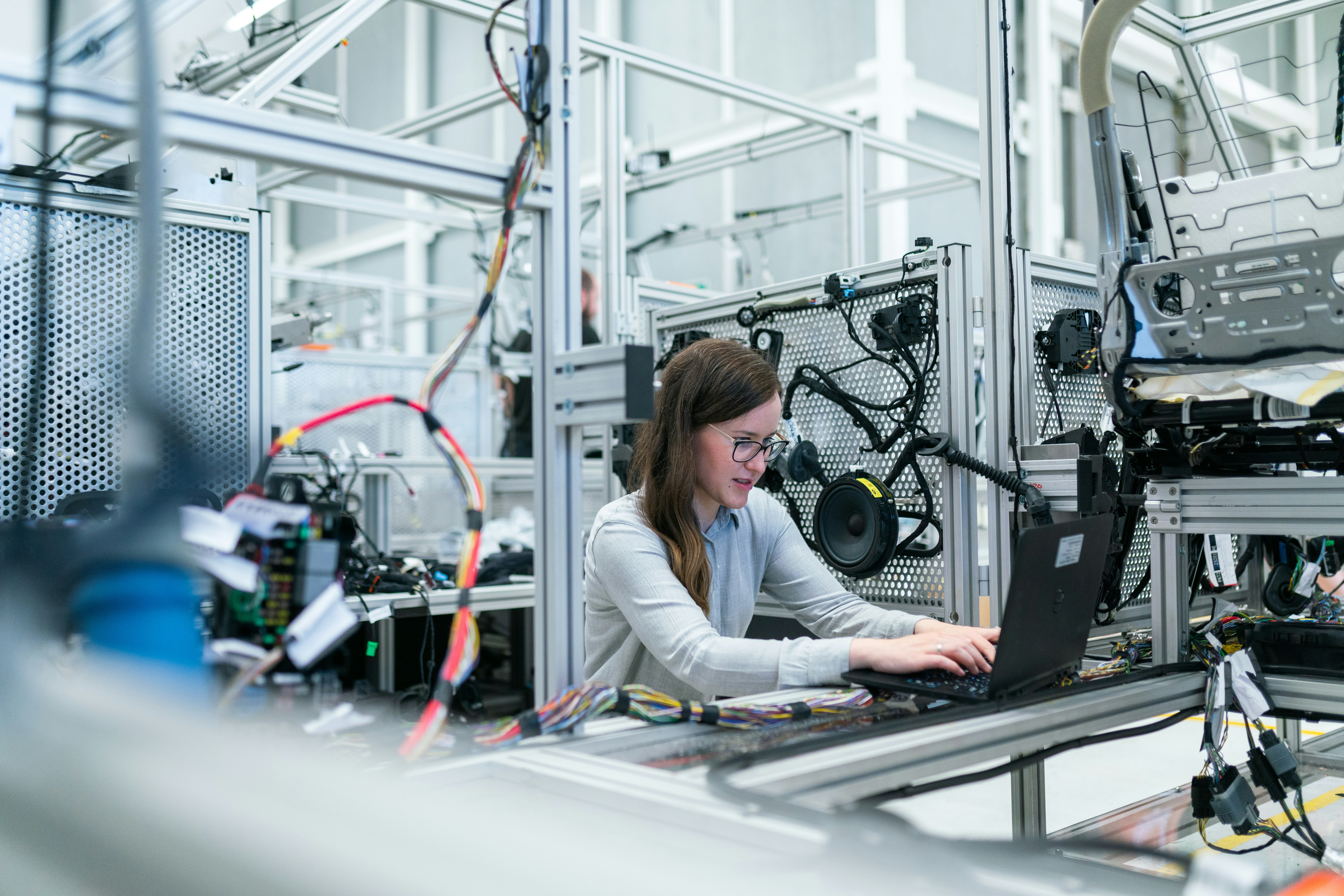 Female engineer or technician working in high-tech environment, ideal for tech podcasts